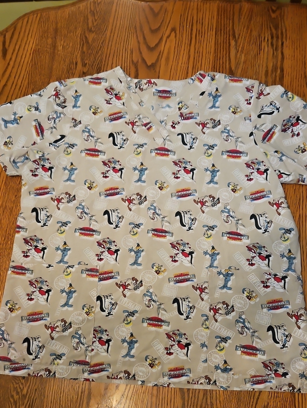 Warner Bros. Beige Looney Tunes All-Over Character Scrub Top